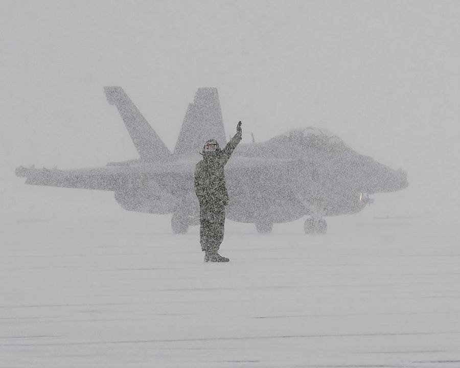 Electronic attack aircraft on a snow-covered flight line